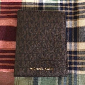 Michael Kors passport wallet.